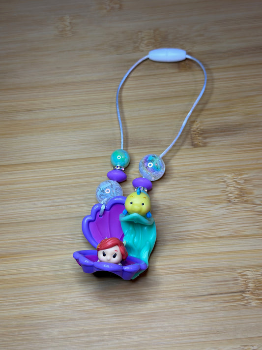 A LITTLE MERMAID AND A GUPPY CAR CHARM...