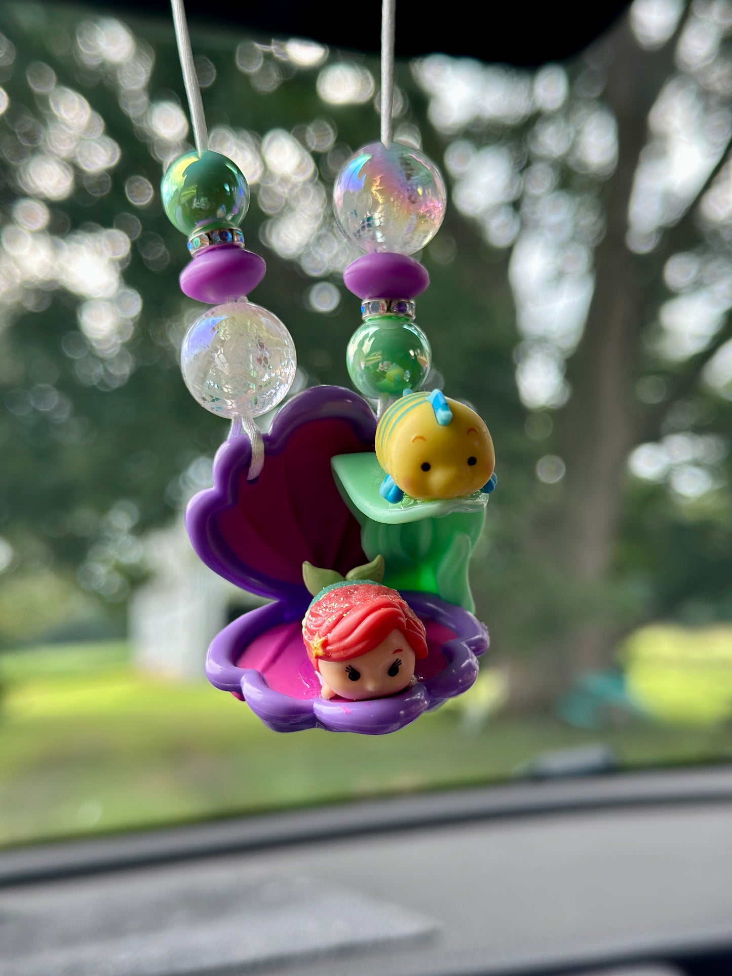 A LITTLE MERMAID AND A GUPPY CAR CHARM...