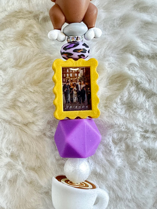 THE ONE THAT YOU PUT ON REAR VIEW MIRROR CAR CHARM...